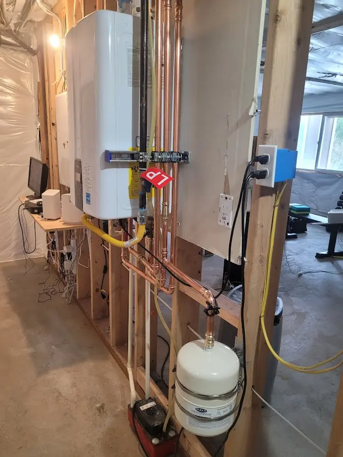 Licensed plumber repairing a kitchen sink in Millstone
